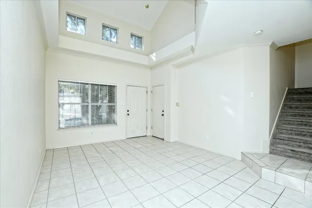 a view of an empty room and window