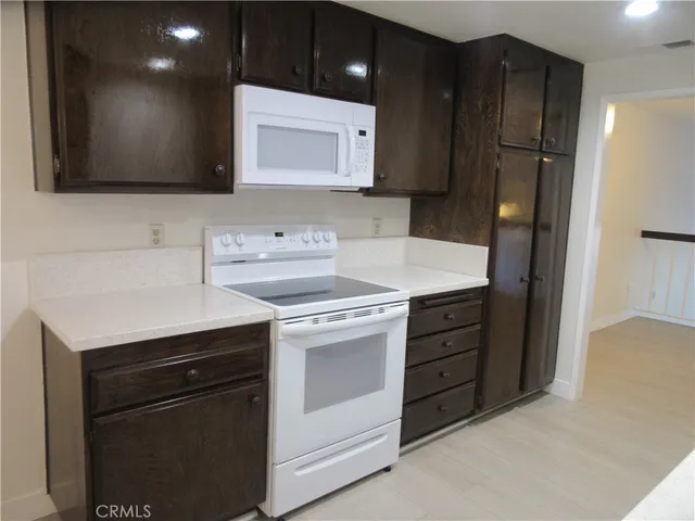 a kitchen with a sink and refrigerator