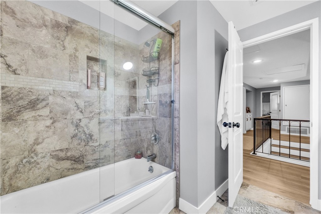 5991 Rogers Lane San Bernardino, CA 92404 - Photo 18 of 33 a bathroom with a bathtub and shower