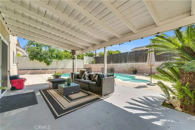 a building outdoor space with patio furniture and potted plants