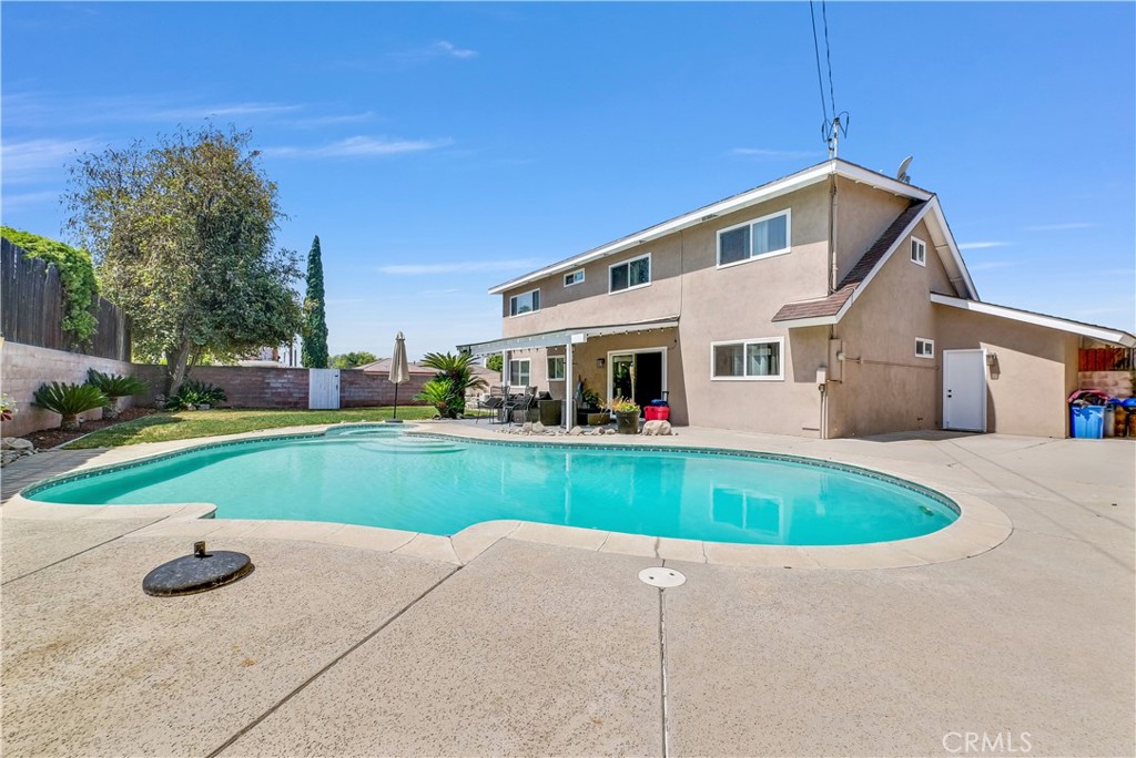 5991 Rogers Lane San Bernardino, CA 92404 - Photo 26 of 33 a view of a house with a yard and sitting area