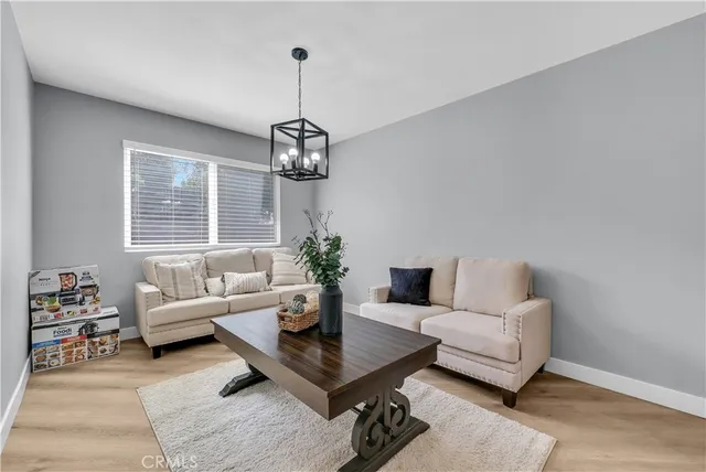 a living room with furniture and a table