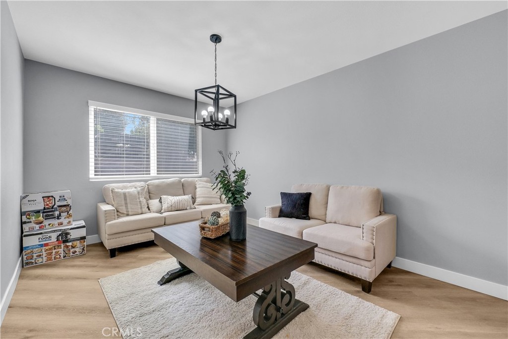 5991 Rogers Lane San Bernardino, CA 92404 - Photo 8 of 33 a living room with furniture and a table