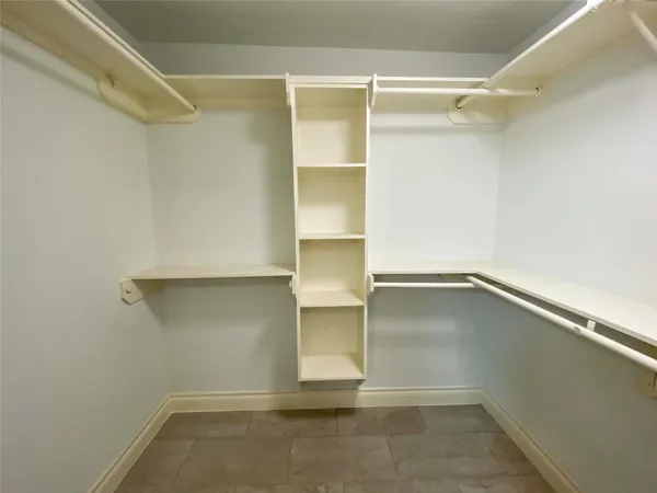 a view of an empty walk in closet