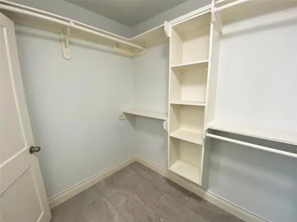 a view of an empty walk in closet