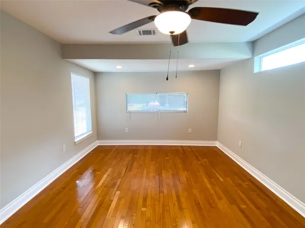 an empty room with a empty space and a window