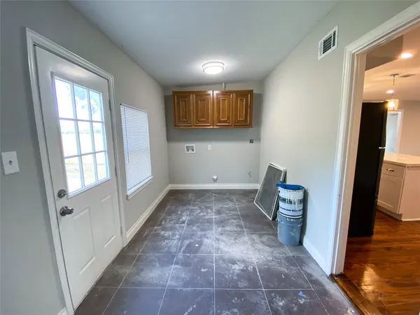 a view of room with window and hardwood floor