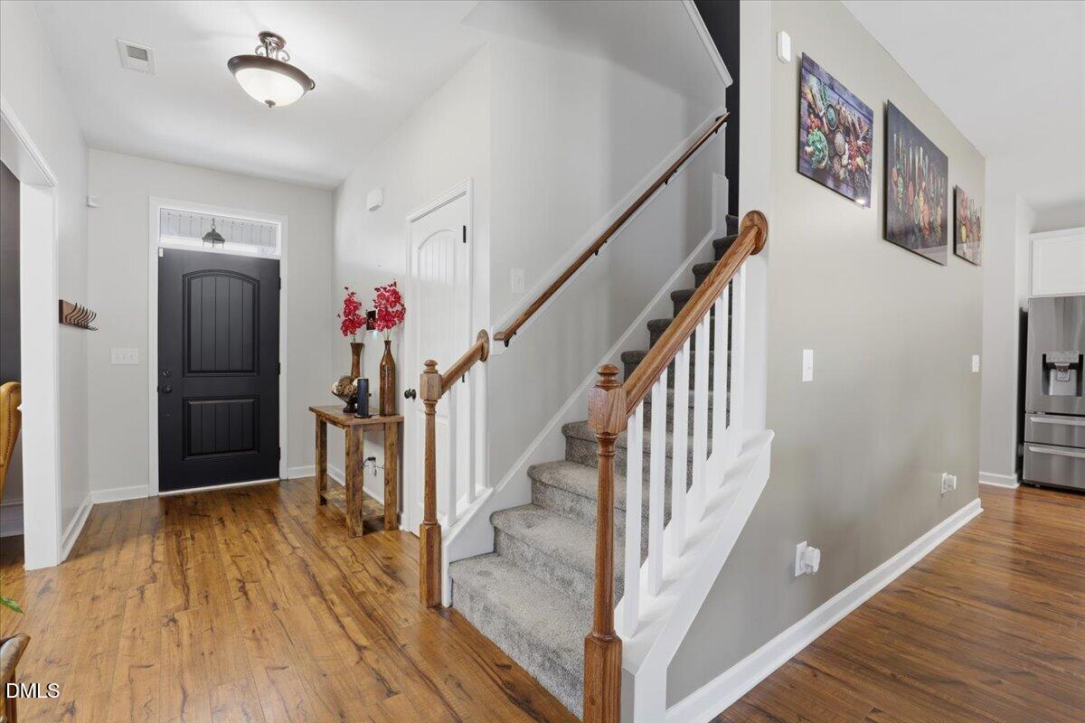 136 Fallingbrook Drive Kenly, NC 27542 - Photo 3 of 7 a view of entryway with wooden floor