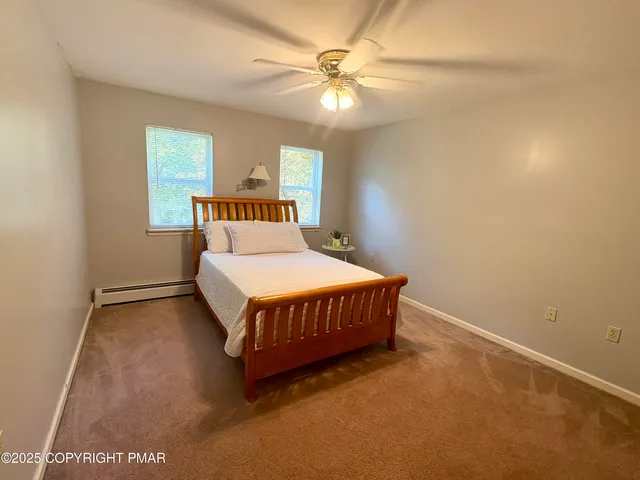 a room with pool table and flat screen tv