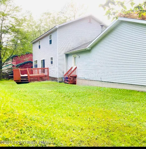 a front view of a house with a garden and patio
