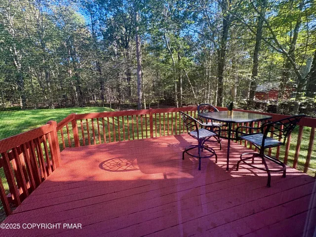 a kitchen with a sink a stove a refrigerator and wooden cabinets