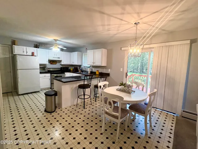 a bedroom with a bed and a television