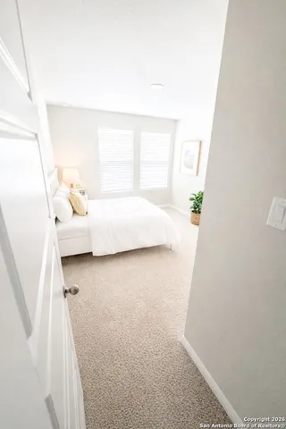 a bed room with a bed and a window