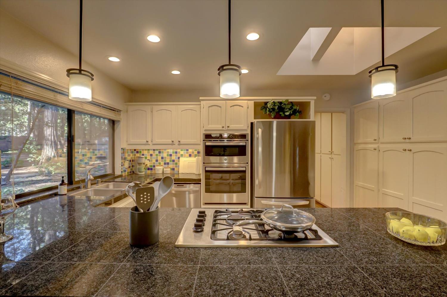 12523 Banner Lava Cap Road Nevada City, CA 95959 - Photo 11 of 57 a kitchen with sink refrigerator and cabinets
