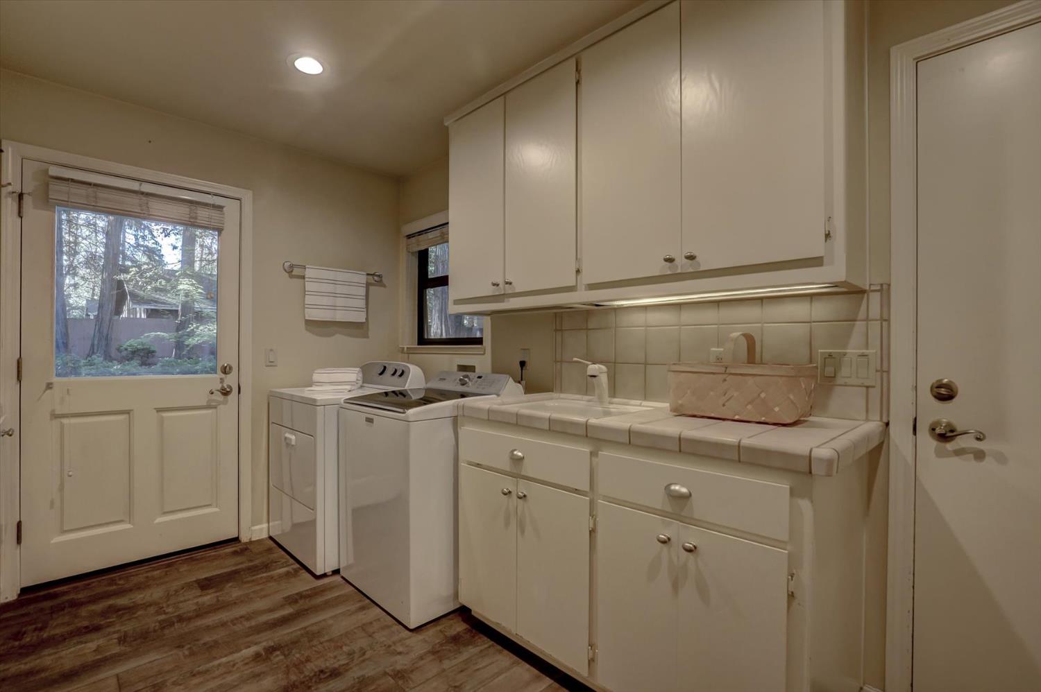 12523 Banner Lava Cap Road Nevada City, CA 95959 - Photo 15 of 57 a room with a sink cabinets and utility room