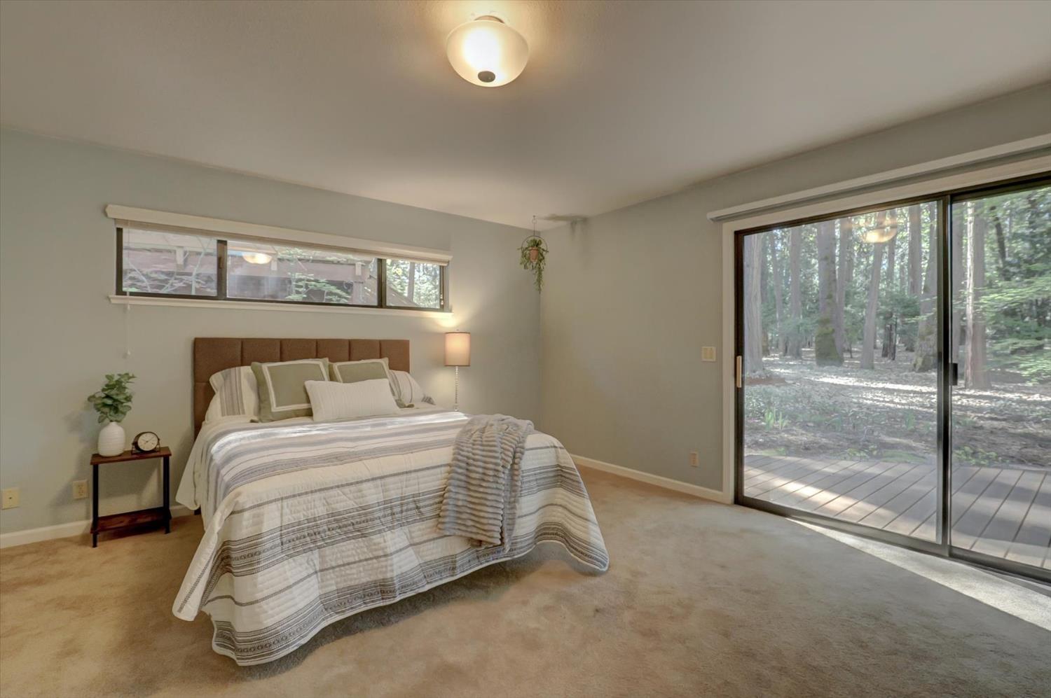 12523 Banner Lava Cap Road Nevada City, CA 95959 - Photo 20 of 57 a bedroom with a bed and a night stand