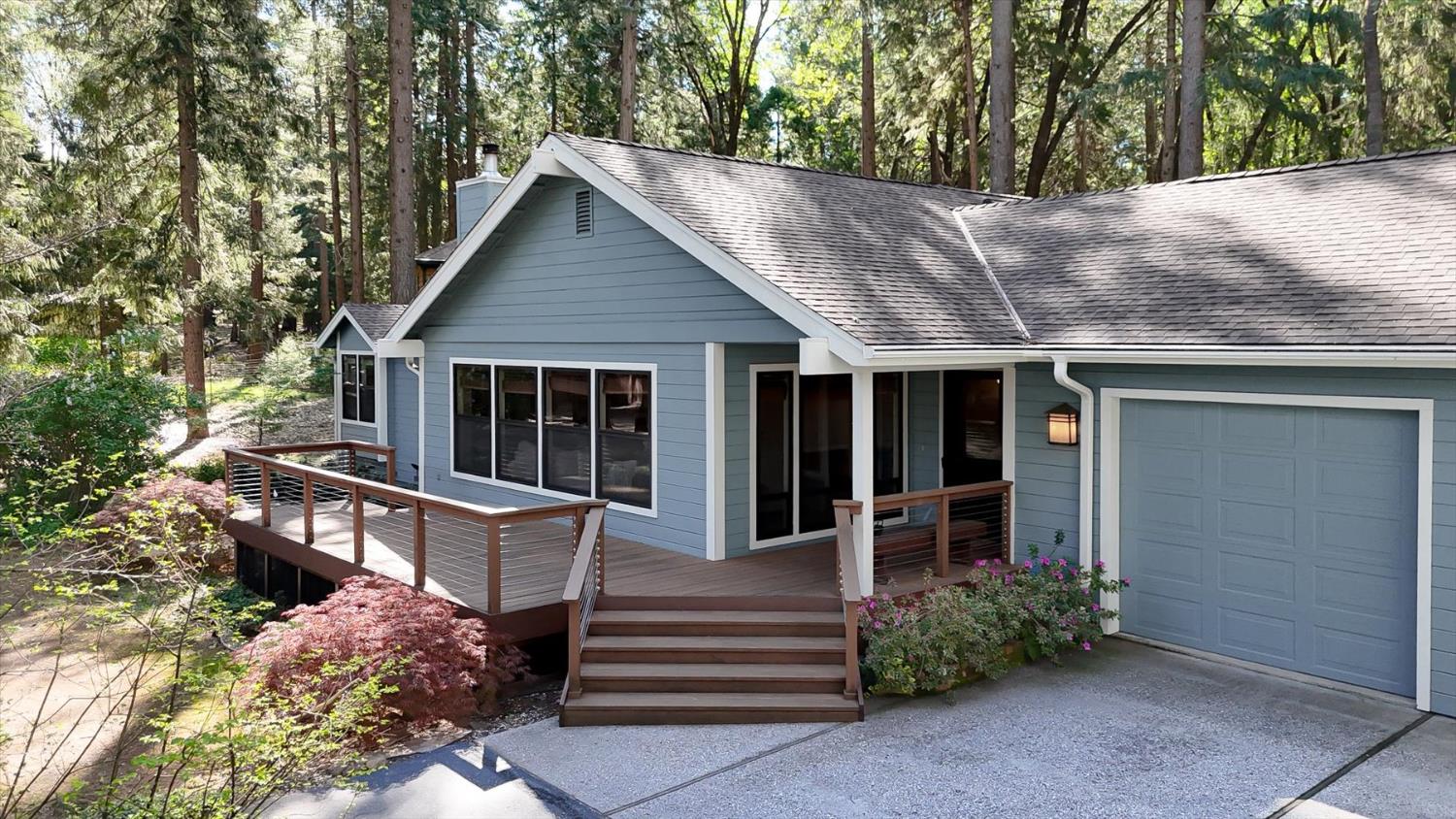 12523 Banner Lava Cap Road Nevada City, CA 95959 - Photo 2 of 57 a front view of a house with a garden