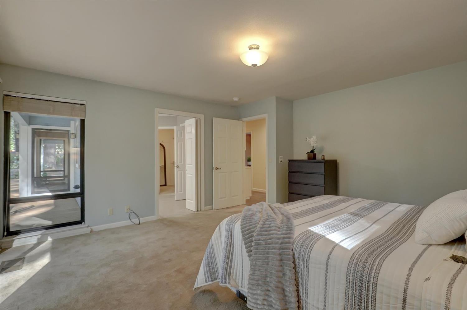 12523 Banner Lava Cap Road Nevada City, CA 95959 - Photo 21 of 57 a bedroom with a bed and a large mirror