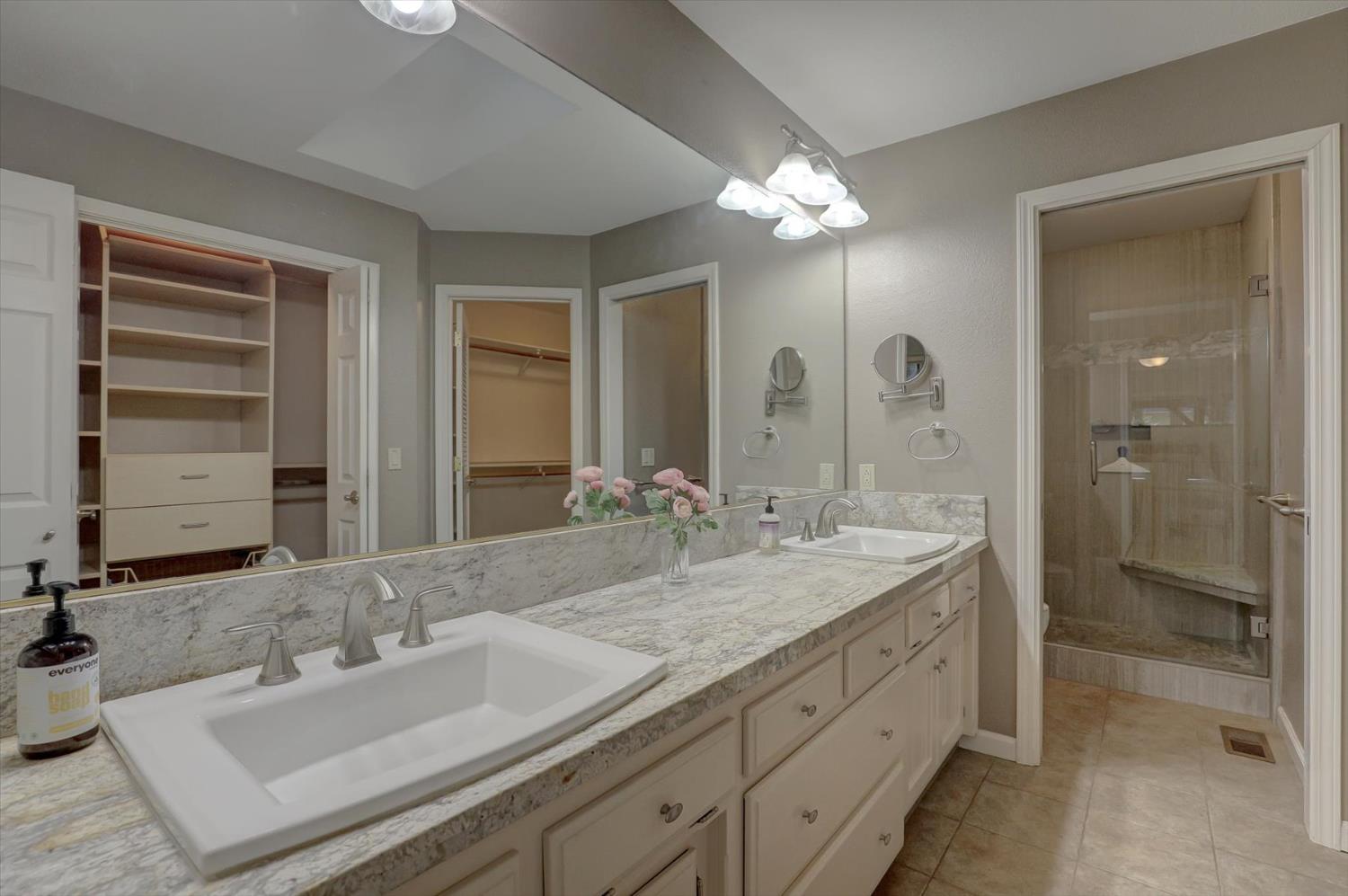 12523 Banner Lava Cap Road Nevada City, CA 95959 - Photo 23 of 57 a bathroom with a double vanity sink and a mirror