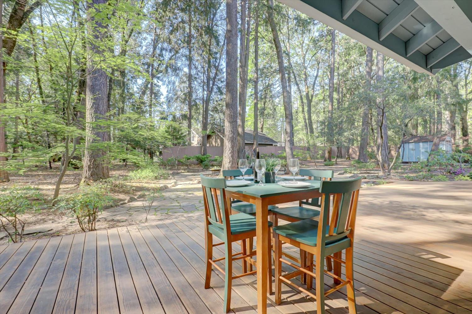 12523 Banner Lava Cap Road Nevada City, CA 95959 - Photo 27 of 57 a view of a patio with table and chairs and wooden floor
