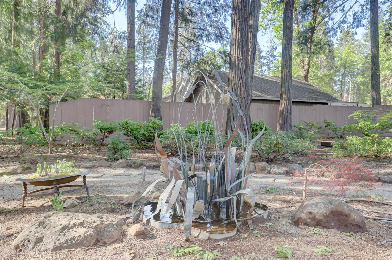 12523 Banner Lava Cap Road Nevada City, CA 95959 - Photo 28 of 57 a view of a bench in the backyard of house