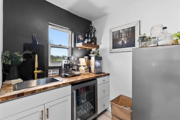 a kitchen with a sink cabinets and window