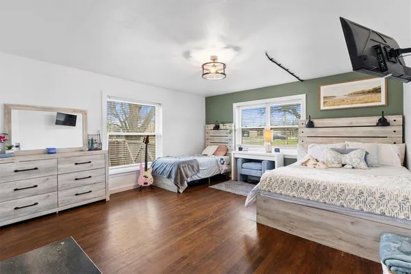 a bedroom with a bed and a dresser