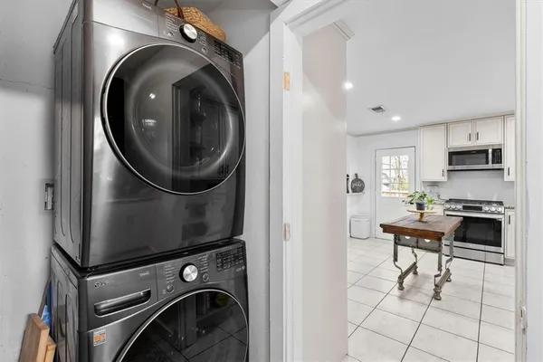 a view of a storage and utility room with washer and dryer