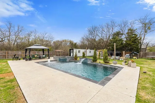 a view of a swimming pool with a lounge chairs