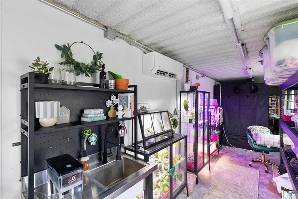 a room with lots of furniture and potted plants