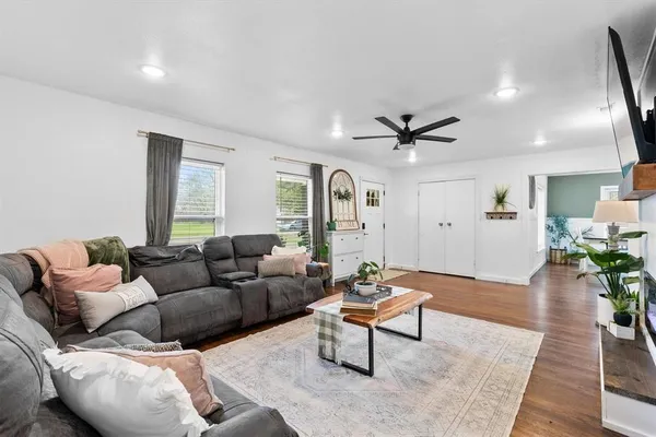 a living room with furniture and a window