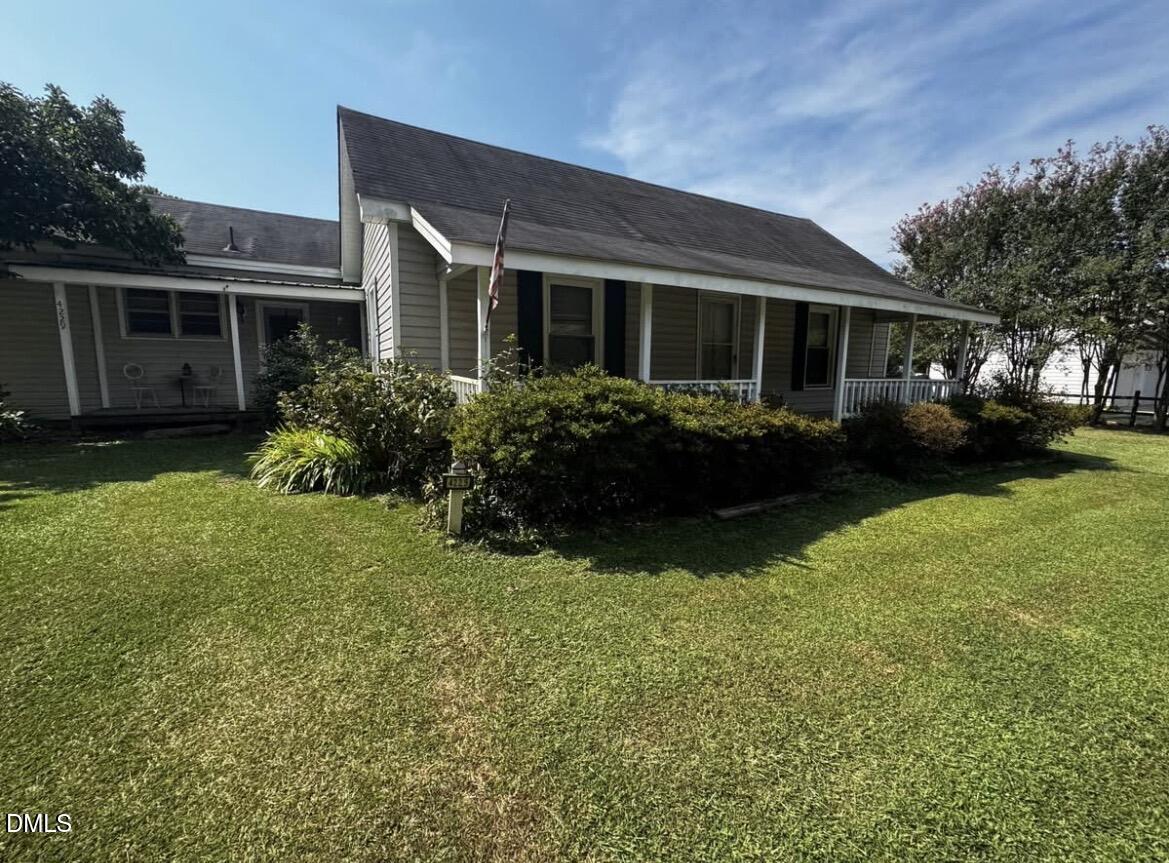 4229 Old Faison Road Knightdale, NC 27545 - Photo 2 of 16 a front view of house with yard and green space