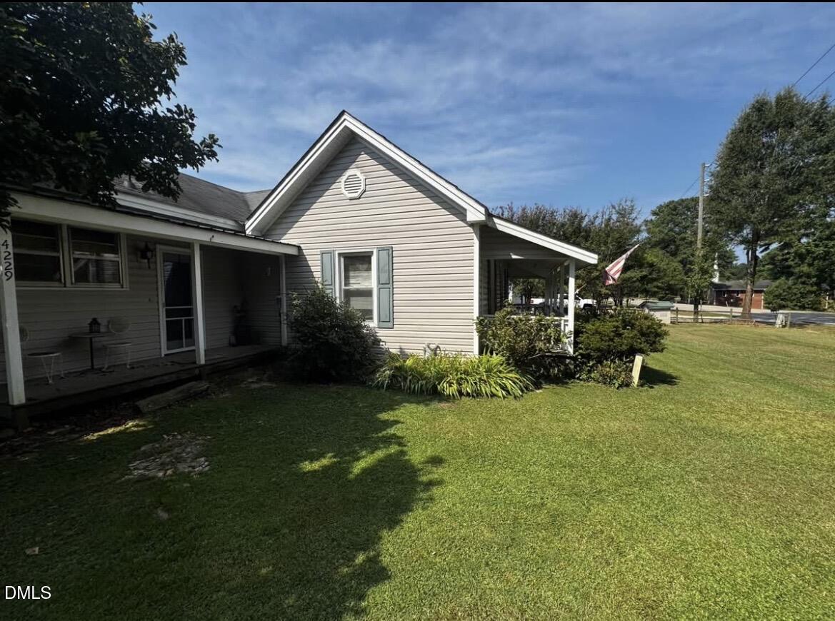 4229 Old Faison Road Knightdale, NC 27545 - Photo 3 of 16 a view of a house with backyard and garden