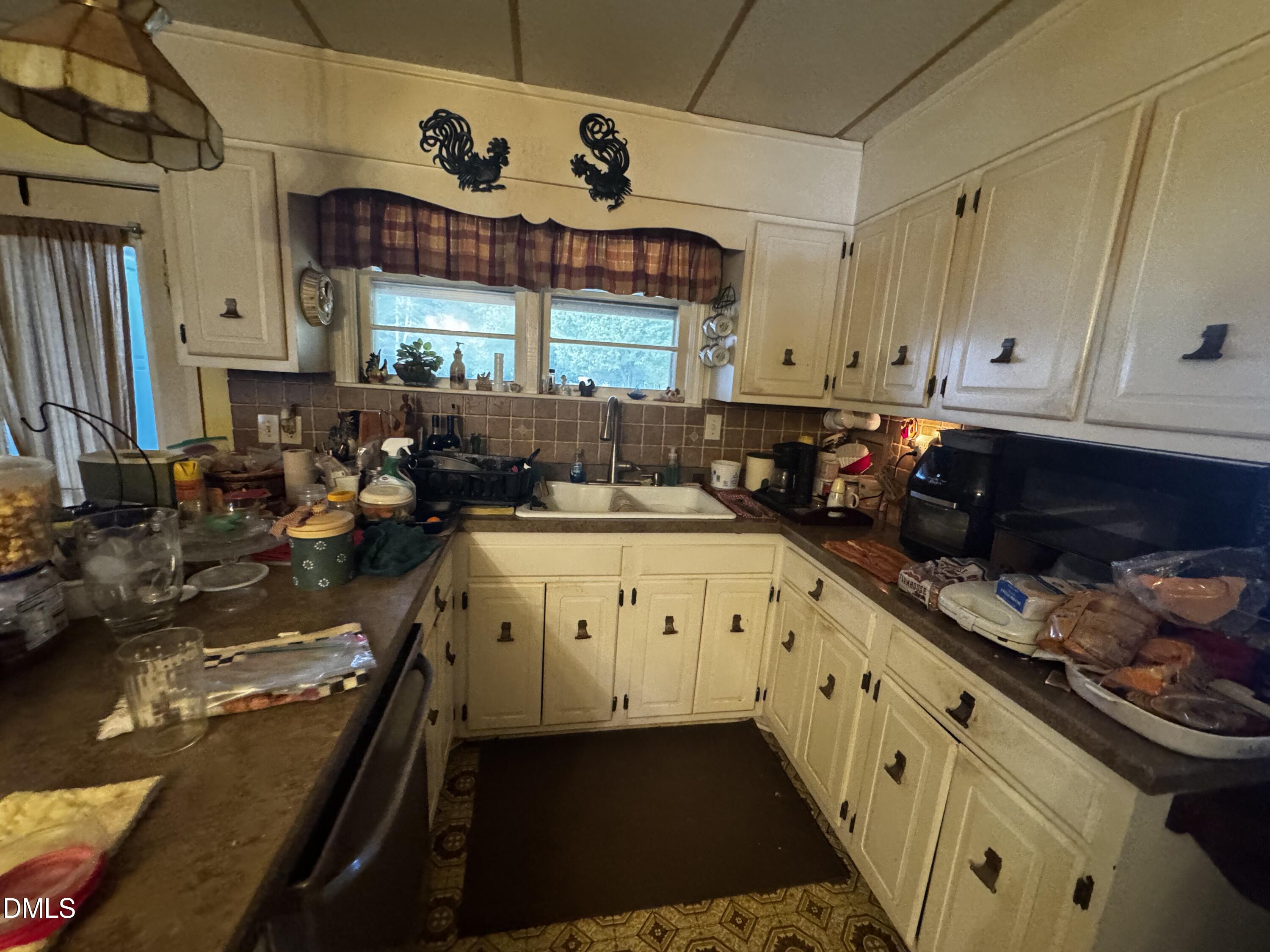4229 Old Faison Road Knightdale, NC 27545 - Photo 4 of 16 a kitchen with stove and cabinets