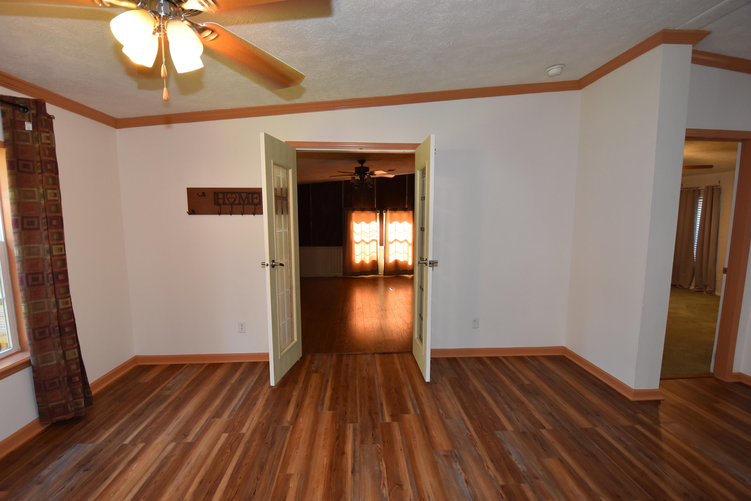 2953 Adams Road Crestview, FL 32536 - Photo 12 of 51 a view of empty room with wooden floor