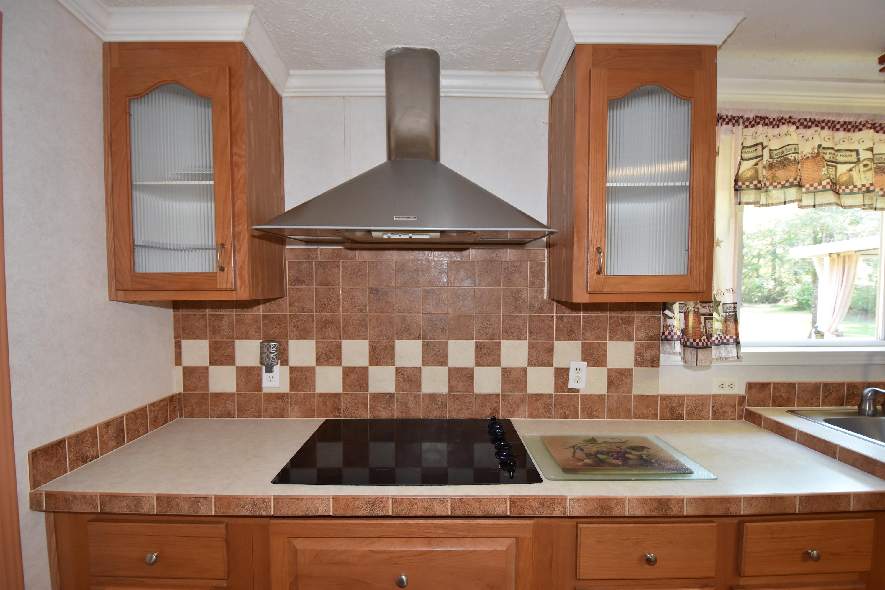 2953 Adams Road Crestview, FL 32536 - Photo 15 of 51 a kitchen with a sink and cabinets