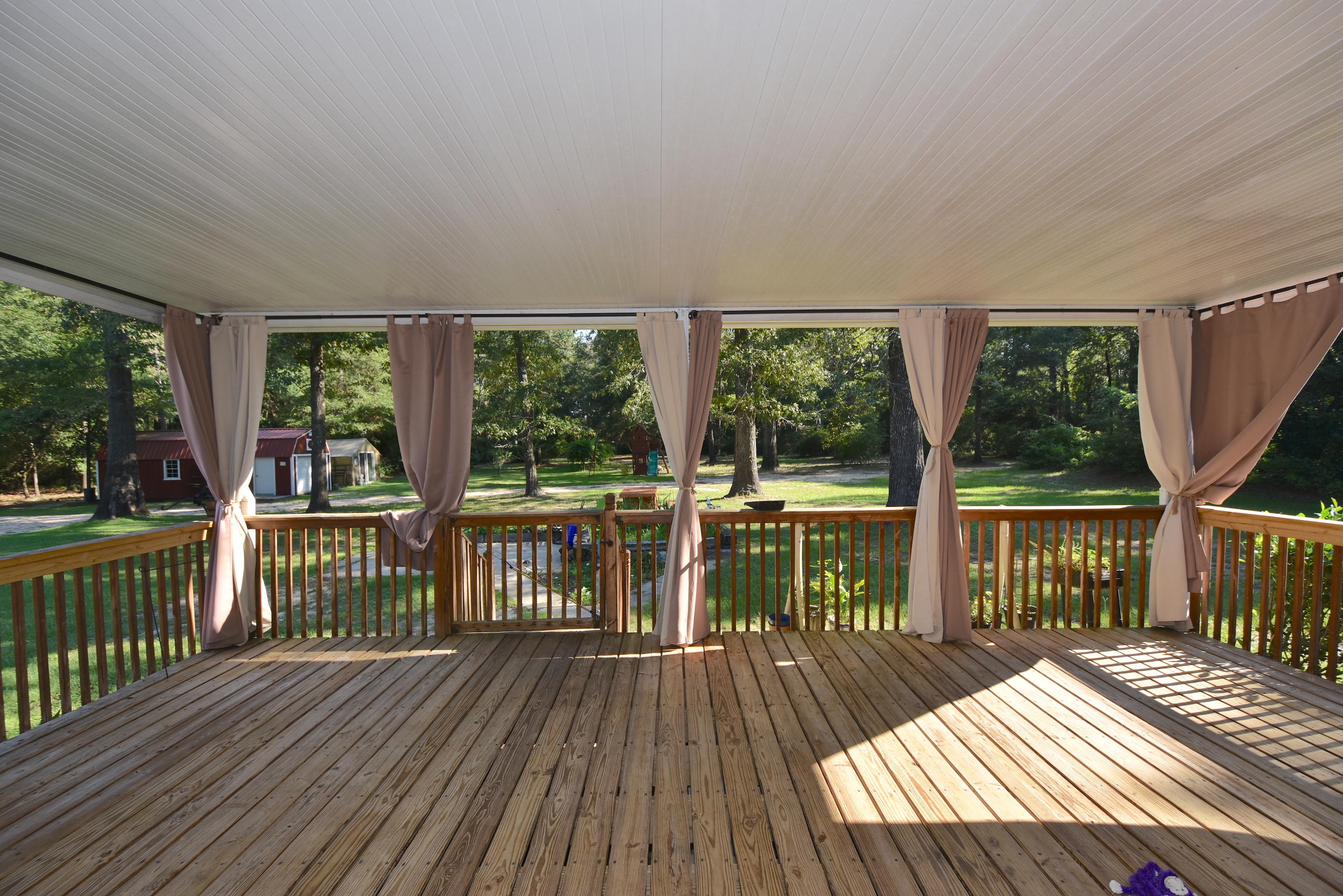 2953 Adams Road Crestview, FL 32536 - Photo 2 of 51 a view of a balcony with wooden floor