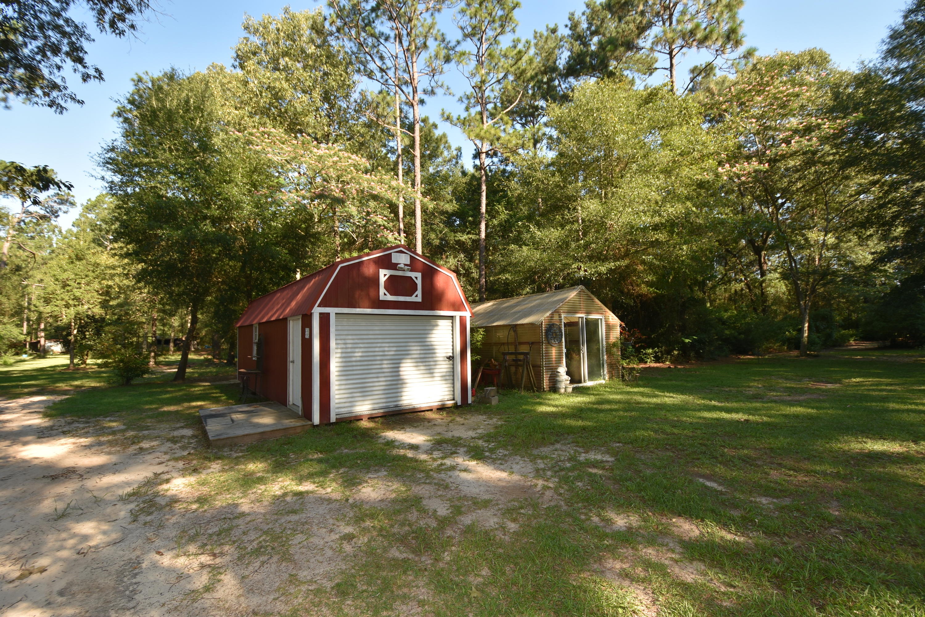 2953 Adams Road Crestview, FL 32536 - Photo 6 of 51 a front view of a house with a yard