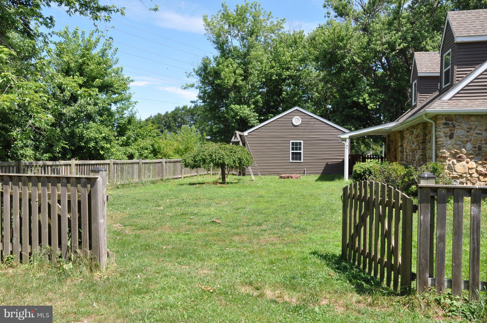 1333 Stone Boundary Road Cambridge, MD 21613 - Photo 29 of 30 Rear Fenced in Area w Drivethru Gate
