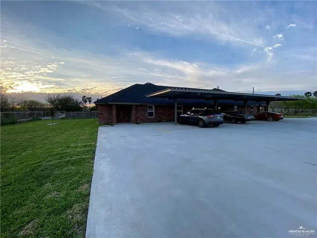 a view of a car park in front of house