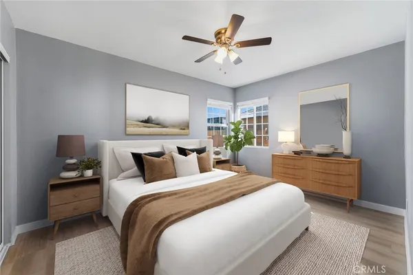 a bedroom with bed and a chandelier