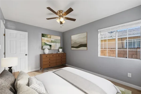 a bedroom with a bed and a window