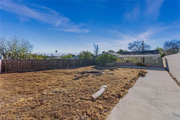 a view of a backyard of a house