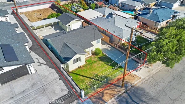 an aerial view of residential houses with outdoor space