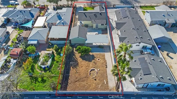 an aerial view of a house with outdoor space