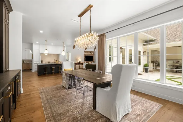 a bathroom with a double vanity sink a mirror and a bathtub