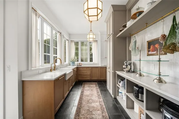 a spacious bedroom with a bed and large windows