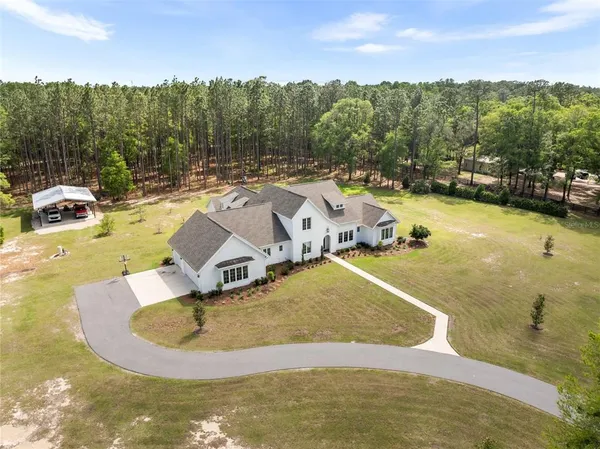 a view of a swimming pool with an ocean view