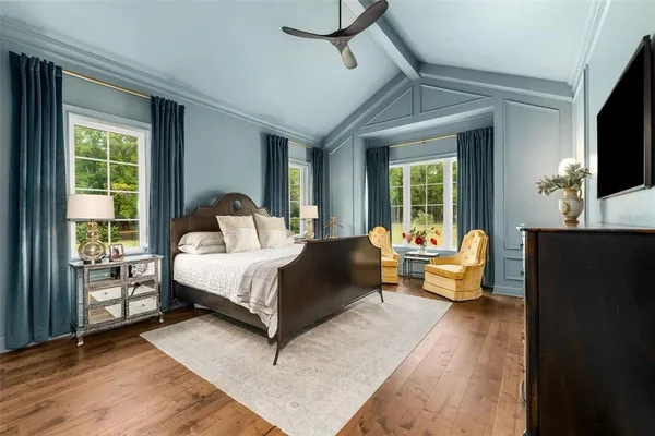 a bathroom with a granite countertop double vanity sink and mirror