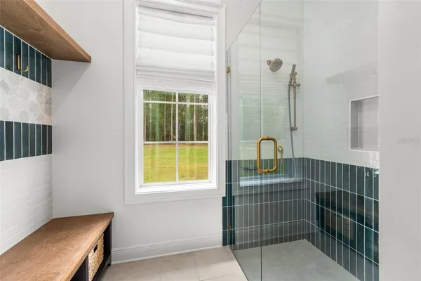 a bedroom with furniture and book shelf